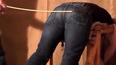 Caned over tight jeans Daddy boy