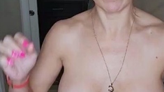 Busty babe playing with her big boobs