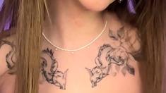 A babe in a rabbit mask shows her phat tits, plumbing