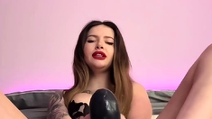 Adrianna Savu plays with a dildo, using her soles to