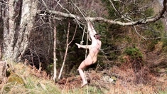 Naked self-bondage in the woods gone wrong.